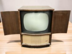 A mid-century television in walnut cabinet, width 64 cm.