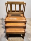 A G-Plan teak nest of three tables, width 50 cm, together with a teak magazine rack.