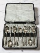A cased set of six silver teaspoons with matching tongs, Birmingham marks.
