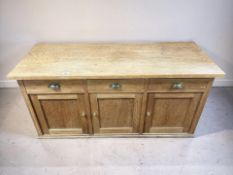 A 20th century oak low cabinet fitted cupboards and drawers, 115 cm x 45 cm x 56 cm.
