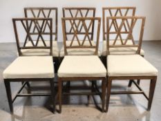 A set of six beech dining chairs.