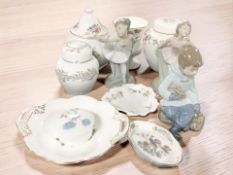 A group of Wedgwood and Coalport cabinet porcelain including lidded jars, urn, pin dishes,
