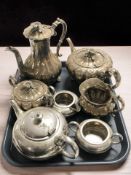 A four piece ornate EPNS tea service and a further three piece service.