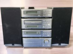 A Denon hi-fi system and a pair of Dali speakers.