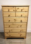 A modern pine eight drawer chest, 80 cm x 41 cm x 123 cm.