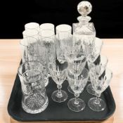 A crystal decanter, various highball glasses, wine glasses, etc.