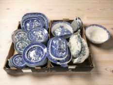 A large quantity of blue and white Willow pattern dinner wares including Wedgwood,