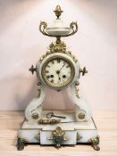 A 19th century French alabaster and gilt metal portico mantel clock, with pendulum and key,