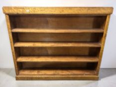 An early 20th century continental satinwood open bookcase, 176 cm x 30 cm x 149 cm.