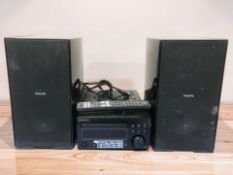 A Denon CD receiver RCD-M41DAB, and a pair of Philips speakers.