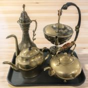 A brass spirit kettle on stand and three further tea / coffee pots.