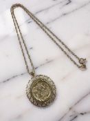 A 9ct gold pendant on chain with inset St George coin CONDITION REPORT: 6.