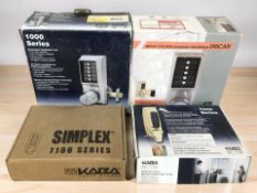 Four boxed door locks including Simplex.