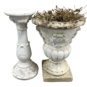 A weathered concrete urn and a further pedestal, height 55 cm.
