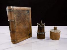 A treen money box in the form of a book, length 17cm,