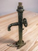 A cast iron water pump, height 101 cm.