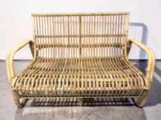 A bamboo two seater settee, width 120 cm.