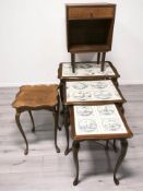 An oak nest of three tile inset tables, width 55 cm, and two further occasional tables.