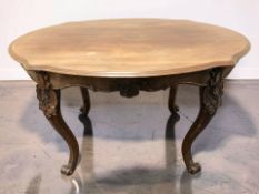 A 19th century continental carved walnut oval breakfast table, 122 cm x 89 cm x 73 cm.
