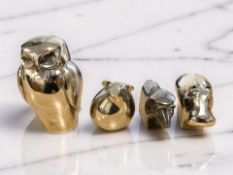 Four Dansk designs silver-plated paperweights modelled as an owl, hippo, pig, and lion, tallest 8cm.
