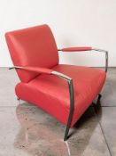 A chrome framed red leather armchair, width 70 cm.