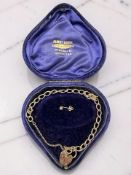 A 9ct gold padlock bracelet CONDITION REPORT: 10.