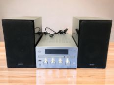 A Sony micro hi-fi component system CMT-G1BIP, and a pair of Sony speakers.