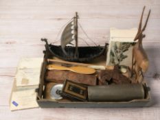 A model of a Viking long ship, various treen, a brass artillery shell casing, money box, etc.