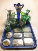 A group of glass tourist paperweights, green glass ewers with hand painted decoration,