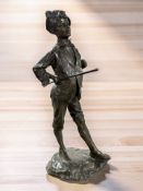 A 19th century patinated bronze figure of a boy, height 31 cm.