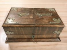An Edwardian oak and EPNS mounted box for cigars and cigarettes, closed width 30 cm.