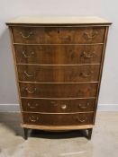 A 20th century Scandinavian walnut and pine bow front six drawer chest, 70 cm x 44 cm x 112 cm.