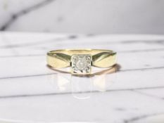 A 9ct gold illusion-set diamond solitaire ring, size J½ CONDITION REPORT: 1.