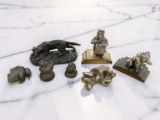 A group of various metal statues and figures, silvered figure of two lovers embracing,