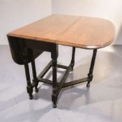 A 19th century oak drop leaf gateleg dining table, width 84 cm.