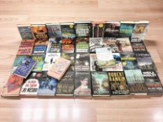 A collection of modern volumes including Chris Ryan, Sheila Quigley, Anton Dubeke, Andy McNab, etc.