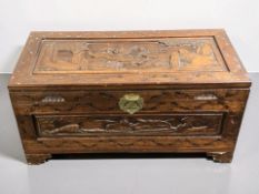 A 20th century Chinese carved camphor wood blanket chest, width 80 cm.