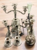 A group of EPNS candlesticks and candelabra, preserve pot in the form of an apple, candle snuffer,