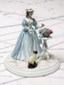 A Coalport figure 'The Rose Arranger', limited edition No. 105 of 1450.
