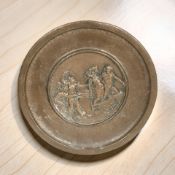 An embossed copper charger depicting charioteers, diameter 30 cm.