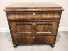 A 19th century continental flame mahogany three drawer chest, 100 cm x 53 cm x 94 cm.