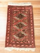 A Turkoman rug, Afghanistan, 140 cm x 78 cm.