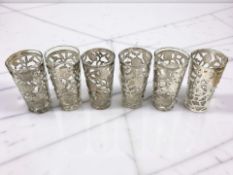 A set of six silver glass holders pierced to create foliage decoration, stamped 