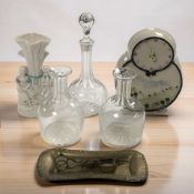 A Marianne Finlayson pottery mantel timepiece, together with a spill vase, three various decanters,