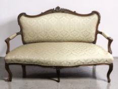 A 20th century French carved beech salon settee, length 150 cm.