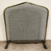 A brass and steel mesh fire guard, width 55 cm.