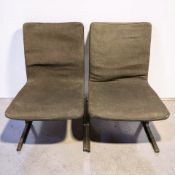 A pair of Scandinavian metal framed low chairs, width 50 cm.