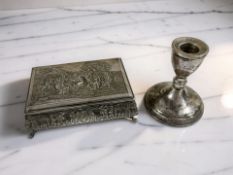 A embossed silver mounted trinket box depicting tavern and country scenes, width 15 cm, stamped 90,