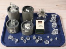 A group of Swarovski and other crystal ornaments, some with boxes.
