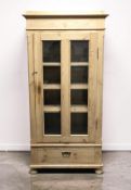 A continental glazed pine single door bookcase, 81 cm x 41 cm x 175 cm.